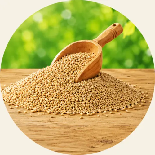 A wooden scoop resting in a mound of Naturion granulate.